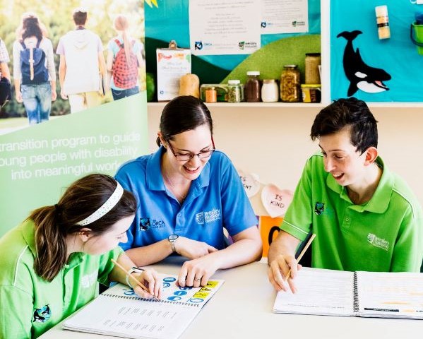 ORCA participants work with staff member