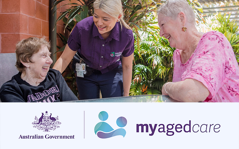 My Aged Care explained | Image shows WMQ carer with two aged care residents in the garden