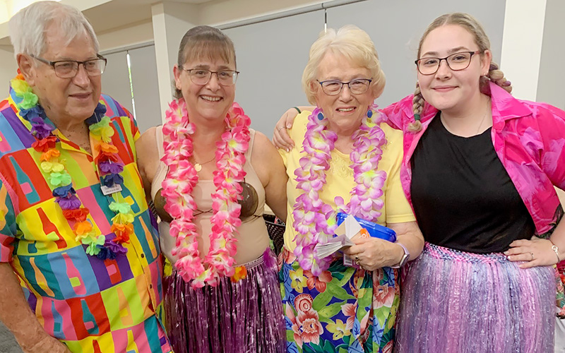 Residents and staff dressed up for a Hawaiian BBQ night at Wheller on the Park retirement community