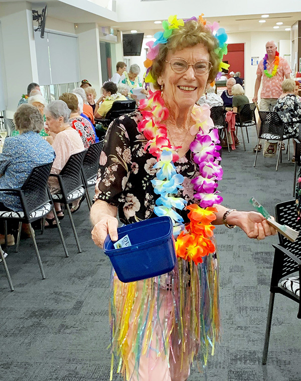 Resident dressed-up at Hawaiian BBQ night on Wheller on the Park retirement community 
