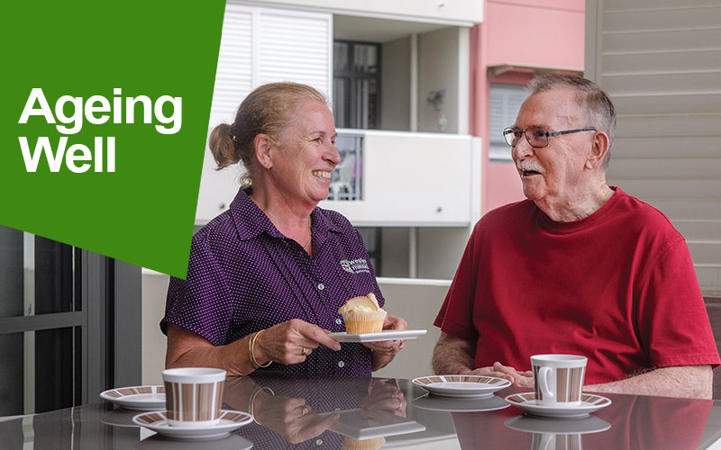 Aged Care worker having tea with a retiree at his home for some companionship.