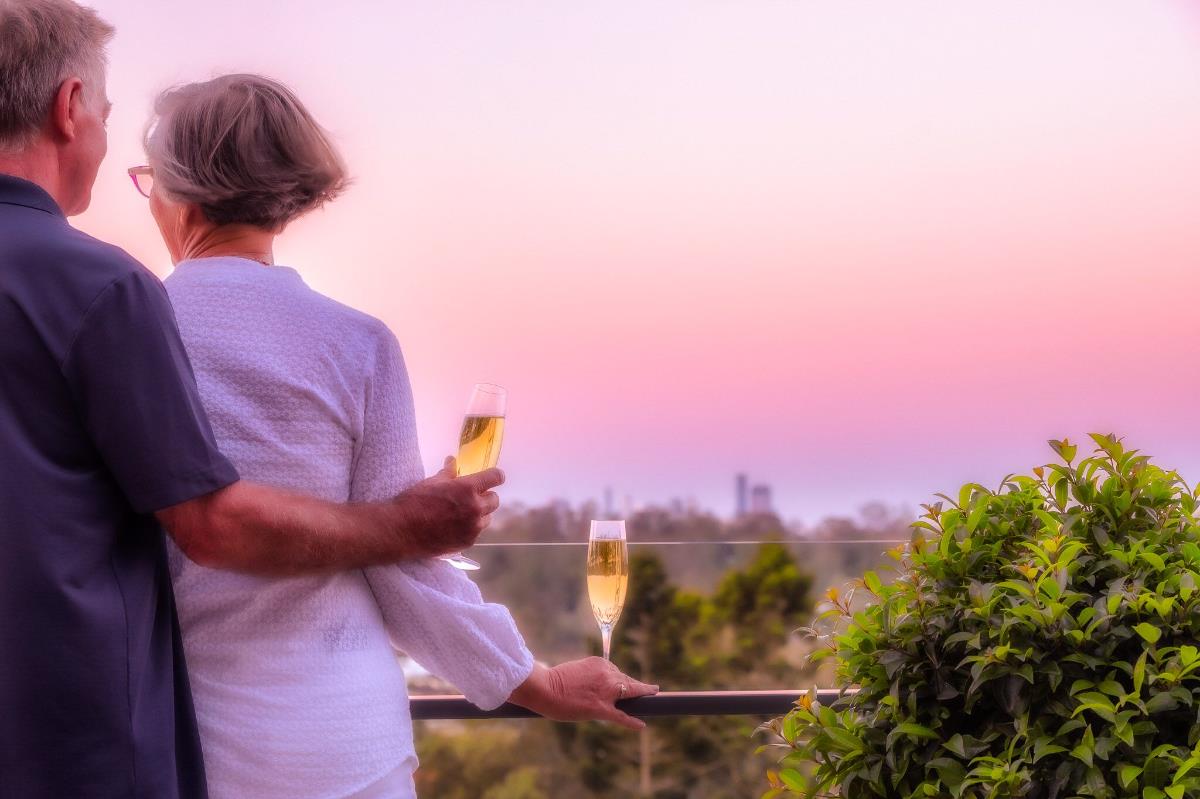 Couple looking out at sunset