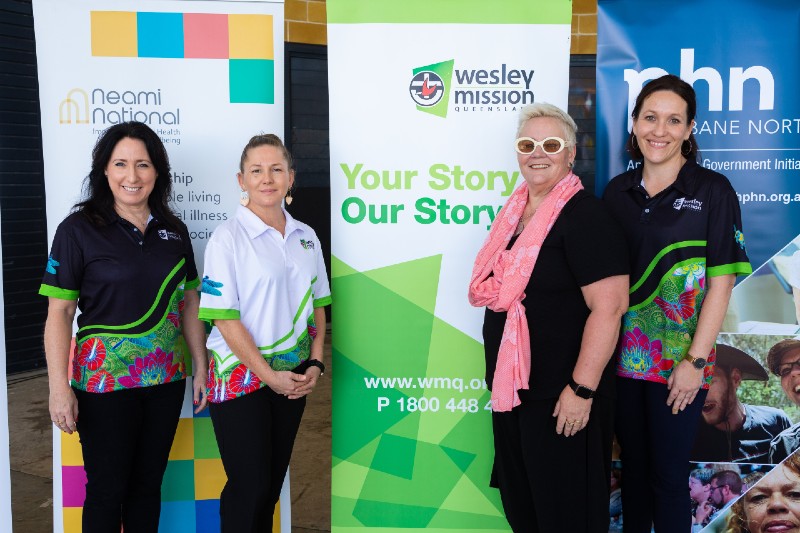 Safe Space Network coordinators and supporter standing together during the launch event